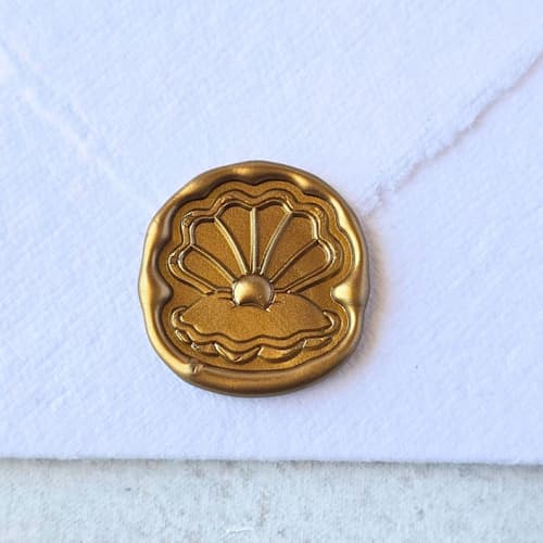 This is a multicolor wax seals by Inkspiringletters called clam - customizable color- set of 25 hand-crafted wax seals in standard