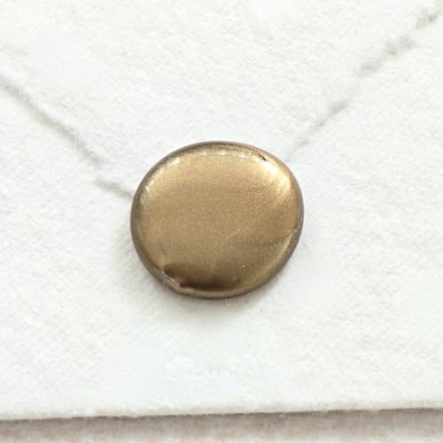 This is a multicolor wax seals by Inkspiringletters called mini natural hand-crafted wax seals - customizable color- set of 25 in standard