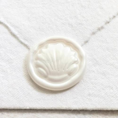 This is a multicolor wax seals by Inkspiringletters called dome shell- hand-crafted wax seals - customizable color- set of 25 in standard