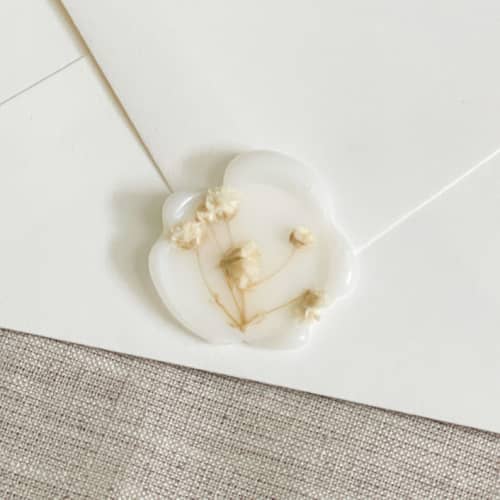 This is a clear wax seals by Orchid Studio called dried baby's breath translucent wax seals | set of 10 in standard