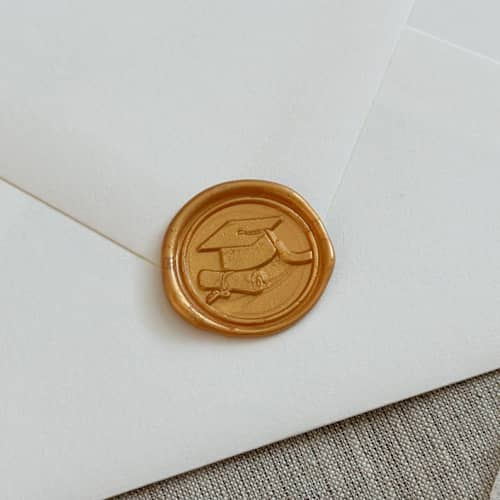 This is a gold wax seals by Orchid Studio called yellow gold graduation wax seal stickers | set of 10 in standard