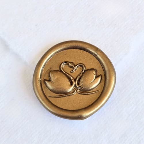 This is a multicolor wax seals by Inkspiringletters called swan lake- customizable color- set of 25 hand-crafted wax seals in standard