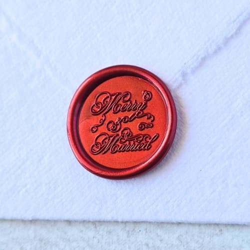 This is a multicolor wax seals by Inkspiringletters called merry & married- customizable color- set of 25 hand-crafted wax seals in standard