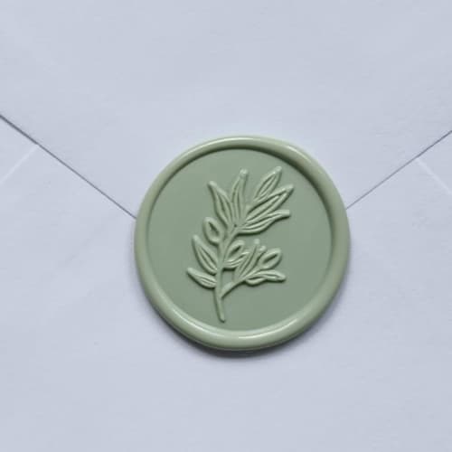 This is a green wax seals by MC silverlinings called customizable color olive self-adhesive wax seals, set of 5 in standard