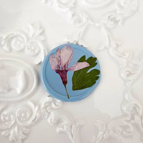 This is a blue wax seals by Caitlin Home called cherry blossom in dusty blue | pack of 10 in standard