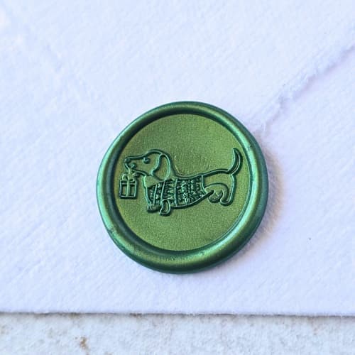 This is a multicolor wax seals by Inkspiringletters called happy howlidays- - customizable color- set of 25 hand-crafted wax seals in standard