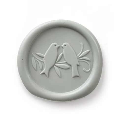 This is a green wax seals by Papel Custom Design called love birds wax seal - thyme - set of 25 in standard
