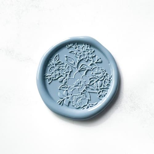 This is a blue wax seals by Abby Choi called french garden wax seal in dusty blue pack of 10 in standard