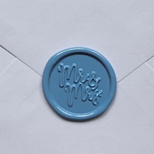 This is a pink wax seals by MC silverlinings called customizable color mr. & mrs. self-adhesive wax seals, set of 5 in standard