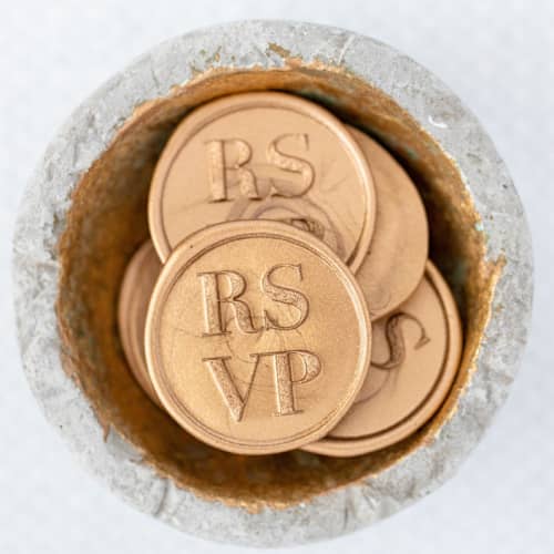This is a gold wax seals by Lindsey Cain called rsvp (sold in sets of 10) in standard