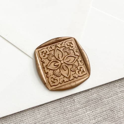 This is a bronze wax seals by Orchid Studio called square tile self-adhesive wax seal in antique gold | large | set of 10 in standard
