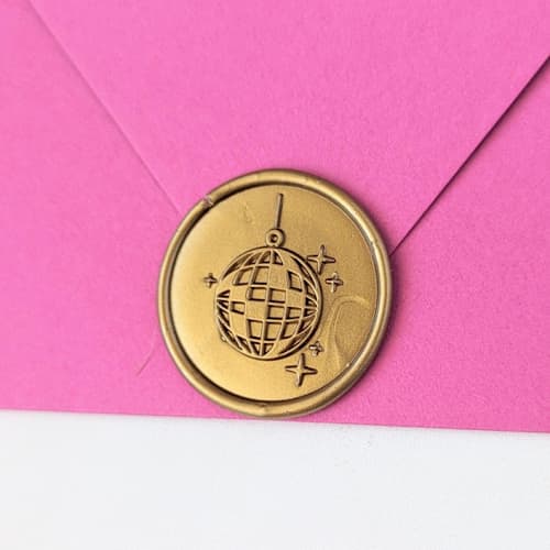 This is a multicolor wax seals by Inkspiringletters called disco ball- customizable color- set of 25 hand-crafted wax seals in standard