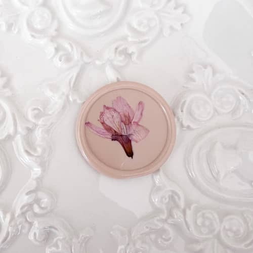 This is a pink wax seals by Caitlin Home called cherry blossom wax seal in pink | pack of 10 in standard