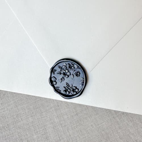 This is a black wax seals by Orchid Studio called black floral pattern 3d wax seal stickers | set of 10 in standard
