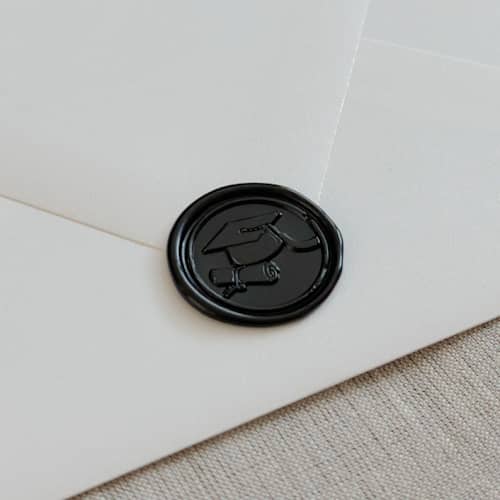 This is a black wax seals by Orchid Studio called black graduation wax seals | set of 10 in standard
