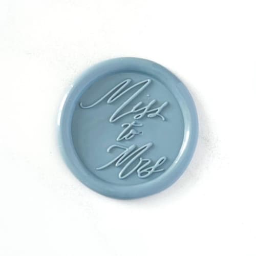 This is a blue wax seals by Abby Choi called miss to mrs wax seals in dusty blue pack of 10 in standard