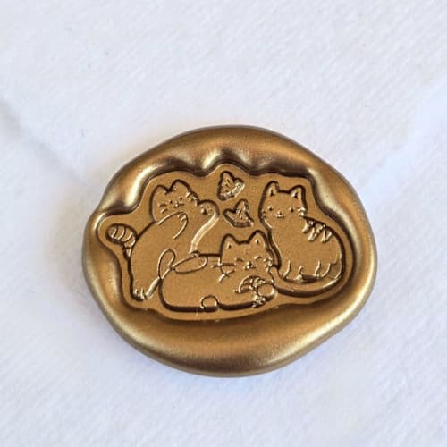 This is a multicolor wax seals by Inkspiringletters called kittens- customizable color- set of 25 hand-crafted wax seals in standard