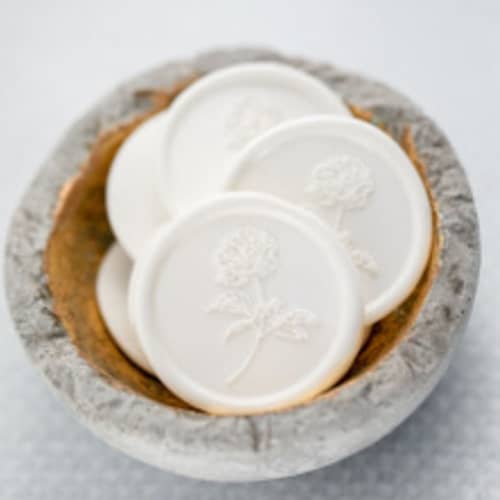 This is a white wax seals by Lindsey Cain called pretty in peony (sold in sets of 10) in standard