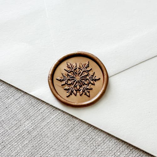 This is a gold wax seals by Orchid Studio called antique gold snowflake wax seal sticker | set of 10 in standard