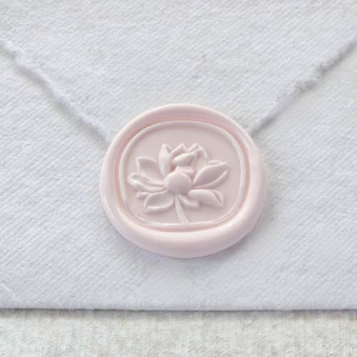 This is a multicolor wax seals by Inkspiringletters called water lily- customizable color- set of 25 hand-crafted wax seals in standard