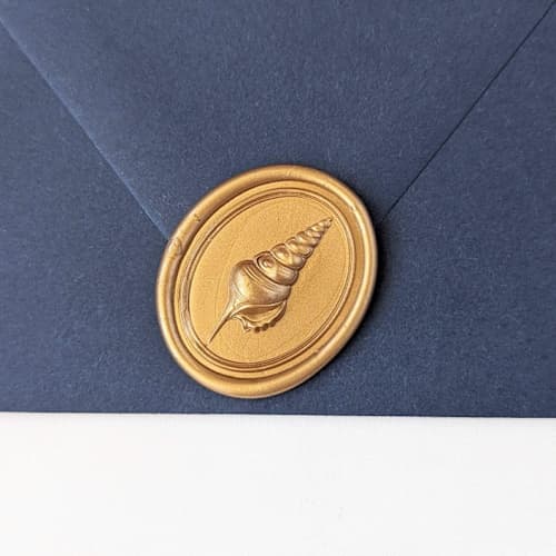 This is a multicolor wax seals by Inkspiringletters called dove seashell- customizable color- set of 25 hand-crafted wax seals in standard