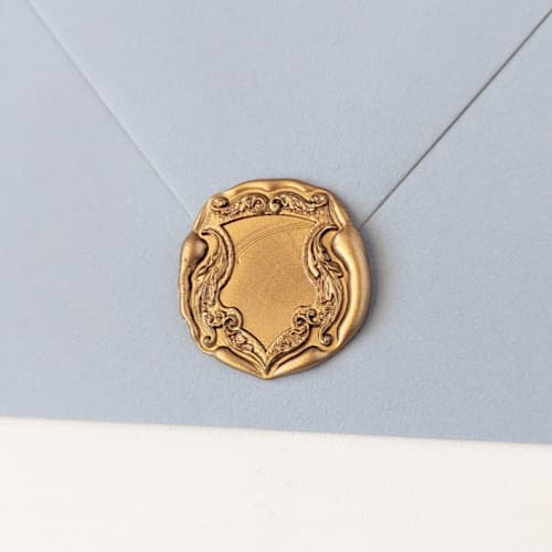 This is a multicolor wax seals by Inkspiringletters called antique french frame- customizable color- set of 25 hand-crafted wax seals in standard