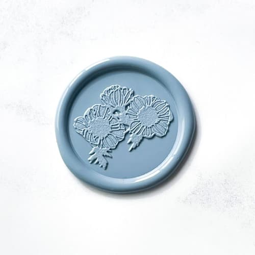 This is a blue wax seals by Abby Choi called anemone in dusty blue, pack of 10 in standard