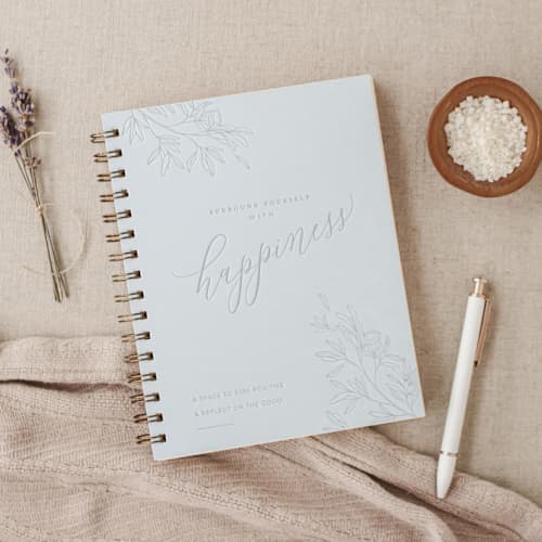 This is a blue journals by Jen Simpson called surround yourself with happiness journal in standard