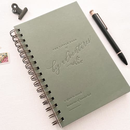 This is a green journals by Jen Simpson called the little book of big adventures // travel journal in standard