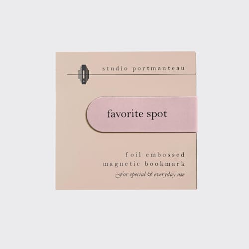 This is a pink journals by Jessica Cunningham called favorite spot magnetic bookmark | literary gift in standard