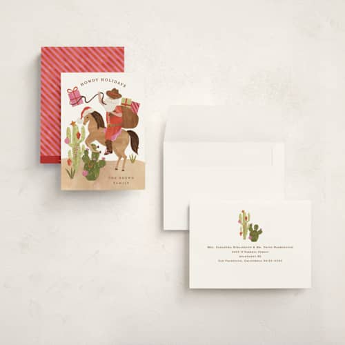 This is a candy cane holiday photo cards with standard by Sarah Knight called howdy holidays y'all printing on signature in grand