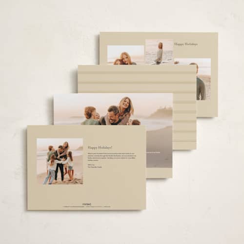 This is a ivory holiday photo cards with standard by Ana de Sousa called just married & merry printing on signature in grand