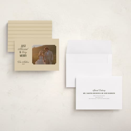 This is a ivory holiday photo cards with standard by Ana de Sousa called just married & merry printing on signature in grand