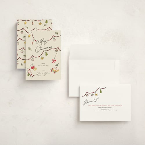 This is a holly berry holiday photo cards with standard by Sarah Rosenthal called garland cheer printing on signature in grand
