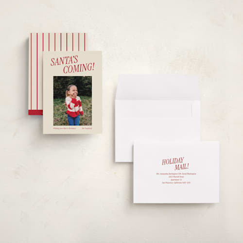 This is a candy cane holiday photo cards with standard by Angela Garrick called santa's coming printing on signature in grand