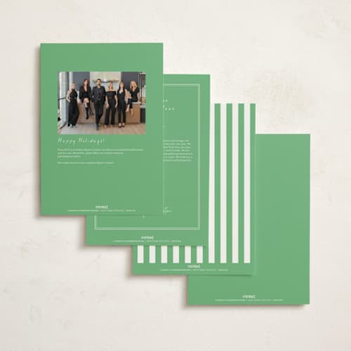 This is a greenery holiday photo cards with standard by mo kelley called wreath with bow printing on signature in grand