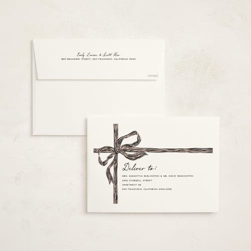This is a holly holiday photo cards with standard by Pixel and Hank called bow printing on signature in grand