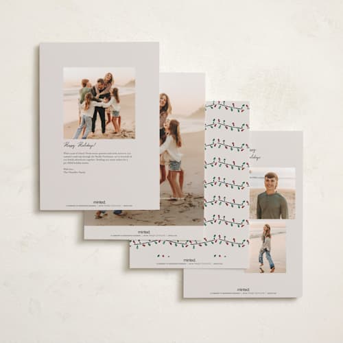 This is a vanilla holiday photo cards with standard by Sarah Rosenthal called festive town printing on signature in grand