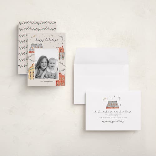 This is a vanilla holiday photo cards with standard by Sarah Rosenthal called festive town printing on signature in grand