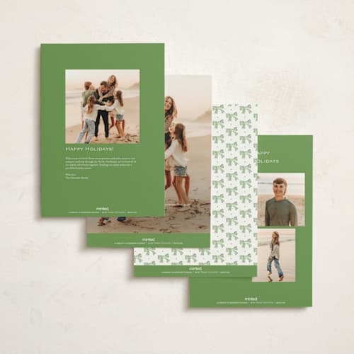 This is a sage holiday photo cards with standard by Sara Hicks Malone called holiday bow printing on signature in grand