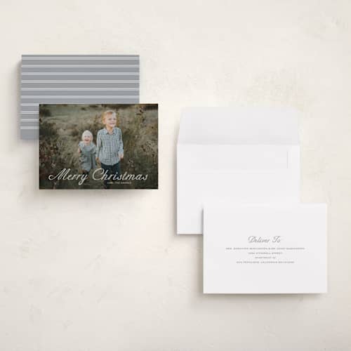 This is a powder holiday photo cards with standard by Carolyn MacLaren called outlined script printing on signature in grand