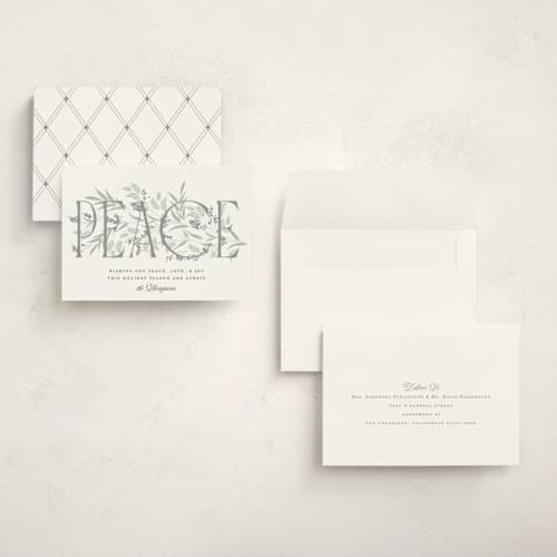 This is a snow holiday photo cards with standard by Robert and Stella called entwined peace printing on signature in grand