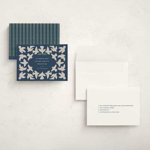 This is a navy holiday photo cards with standard by Tanamachi Studio called let there be peace printing on signature in grand
