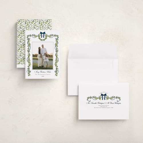 This is a winter berry holiday photo cards with standard by Susan Moyal called bows & ribbon printing on signature in grand
