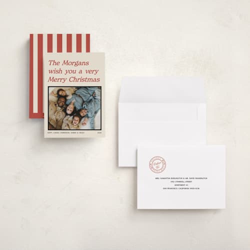 This is a cream holiday photo cards with standard by Robert and Stella called holiday headline printing on signature in grand