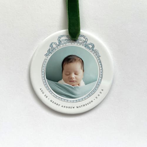 This is a white holiday decorations by Holly Whitcomb called personalized baby photo ornament - vintage ribbon in standard