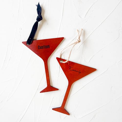 This is a brown holiday decorations by Left Grain called custom leather martini glass ornament - personalized in standard