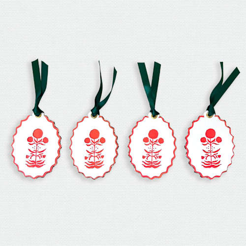 This is a multicolor holiday decorations by Lottie Aldarwish called paper cut out hand painted in vibrant coral block print ornaments - set of 4 in standard