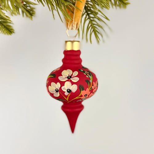 This is a multicolorassorted-colors holiday decorations by Sara Swanson called festive red floral- long curvy shaped ornament in standard
