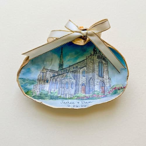 This is a multicolor holiday decorations by Laura Kinsella called custom wedding venue portrait seashell ornament in standard